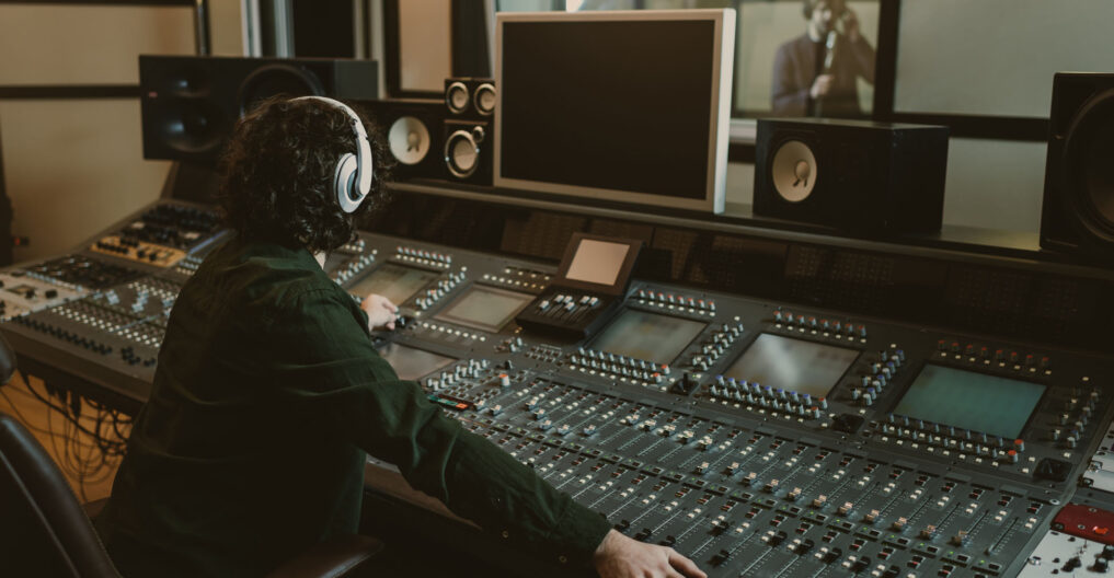 sound producer working at studio while recording song sound producer working at studio while recording song
